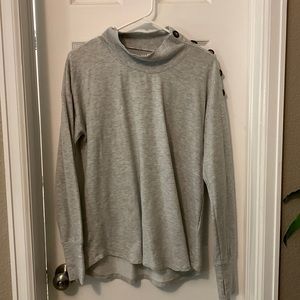 Sweatshirt material turtleneck sweater with buttons across shoulder. Size M